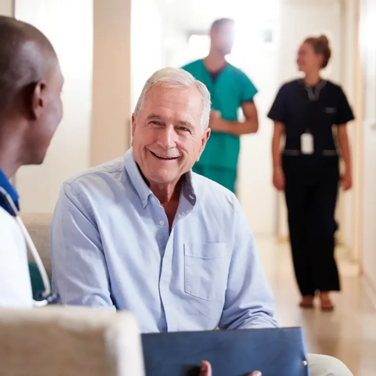 doctor-welcoming-to-senior-male-patient-being-admi-2026-03-10-03-59-08-utc