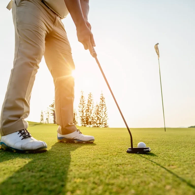 lifestyle, golf, activity, outdoor, sport, golfer concept. Golf balls that are going to be hole by golfers at the green grass golf course at sunset.